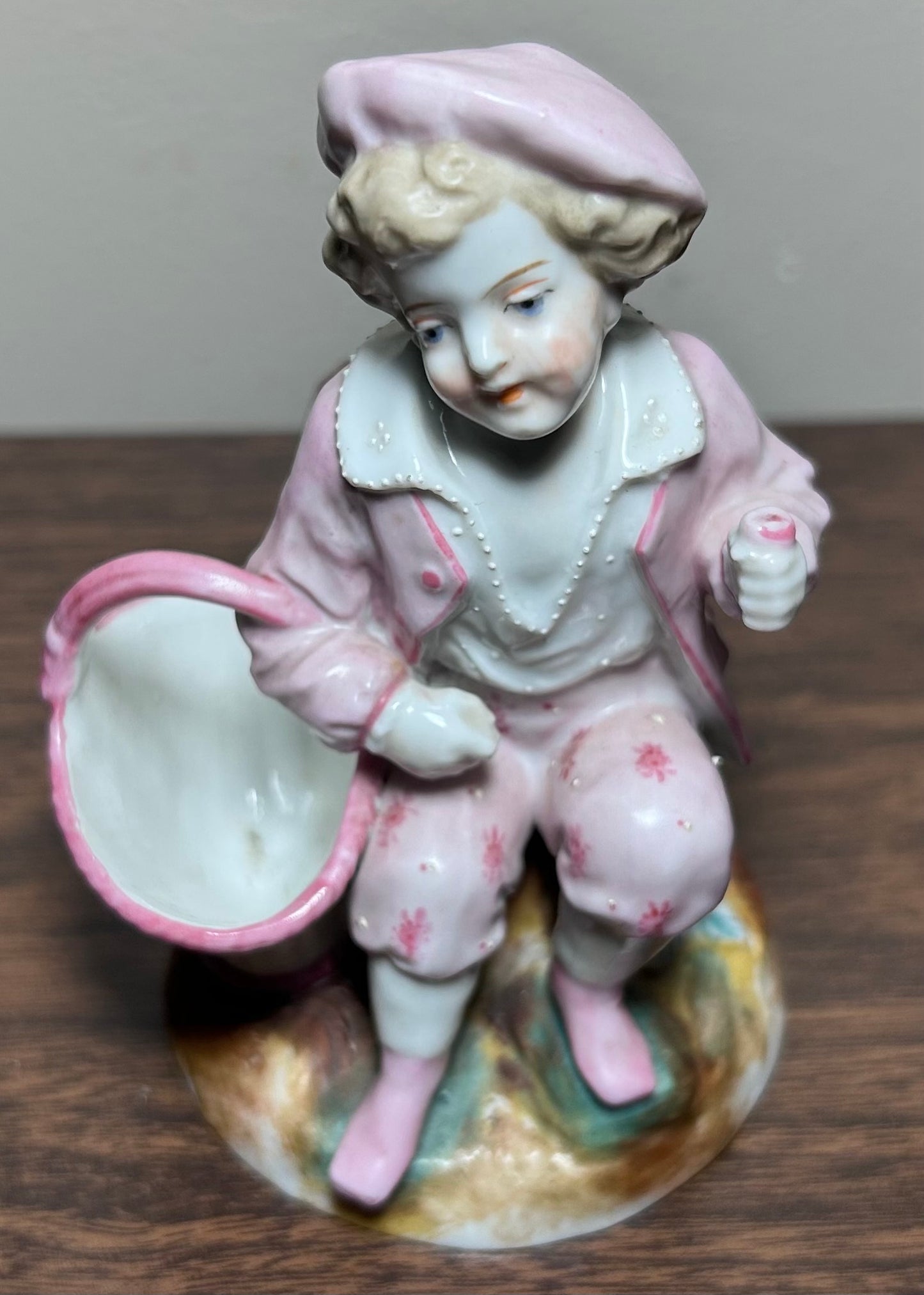 Circa 1870 German Victorian Conta & Boehme Porcelain Young Boy with Flower Basket Figural Matchstick Holder China Fairing