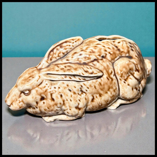 Up for sale is a Late 19th Century English Victorian Staffordshire Mottled Brown Glazed Porcelain Rabbit Laying Down Figural Bank