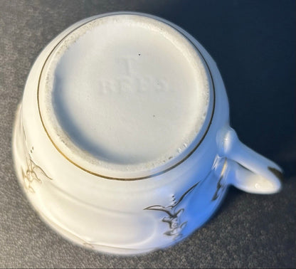 Late 19th Century French Rococo Revival T. REES. Porcelain Gilded Floral/Vine Motifs Teacup and Saucer Set