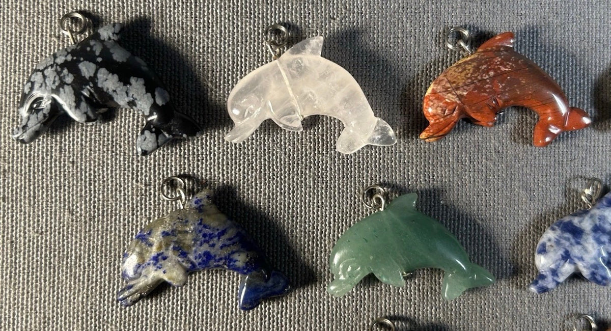 Lot of 11 Carved Polished Natural Gemstone, Crystal, and Art Glass Composite Dolphin Jewelry Pendants