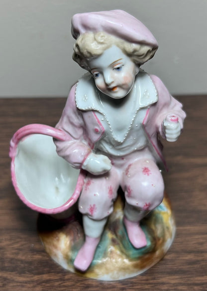 Circa 1870 German Victorian Conta & Boehme Porcelain Young Boy with Flower Basket Figural Matchstick Holder China Fairing
