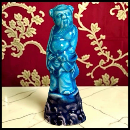 Circa 1920 Chinese Turquoise/Aubergine Glazed Porcelain Taoist Immortal Li Tieguai Figurine (Early Republic Period)