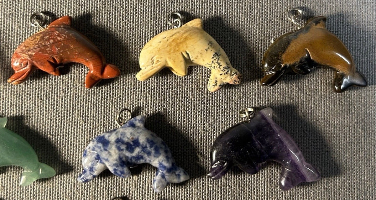Lot of 11 Carved Polished Natural Gemstone, Crystal, and Art Glass Composite Dolphin Jewelry Pendants
