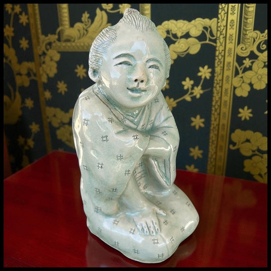 Vintage Mid 20th Century Japanese Young Boy Kneeling Carved Crackle Glazed Celadon Ceramic Sculptural Figure (Showa Period)