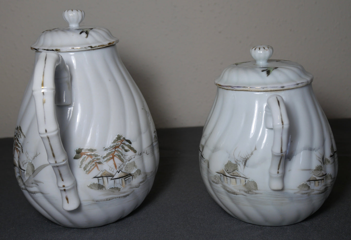Circa 1920 Japanese Kutani Porcelain Hand Painted Village Motifs Bamboo Handled Teapot and Lidded Sugar Bowl Set (Taisho Period)