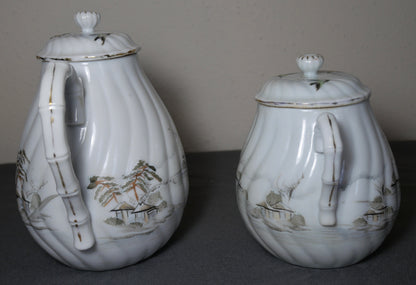 Circa 1920 Japanese Kutani Porcelain Hand Painted Village Motifs Bamboo Handled Teapot and Lidded Sugar Bowl Set (Taisho Period)