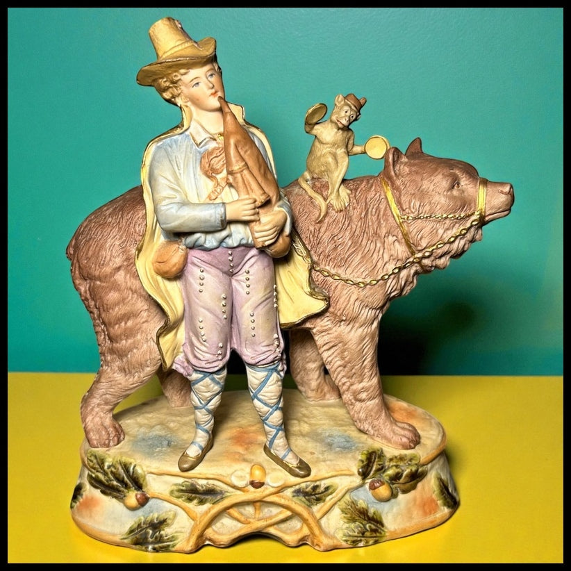 Circa 1930 German Scheibe-Alsbach Kister Bisque Porcelain Man with Bagpipes/Monkey with Cymbals Atop Grizzly Bear Figural Group