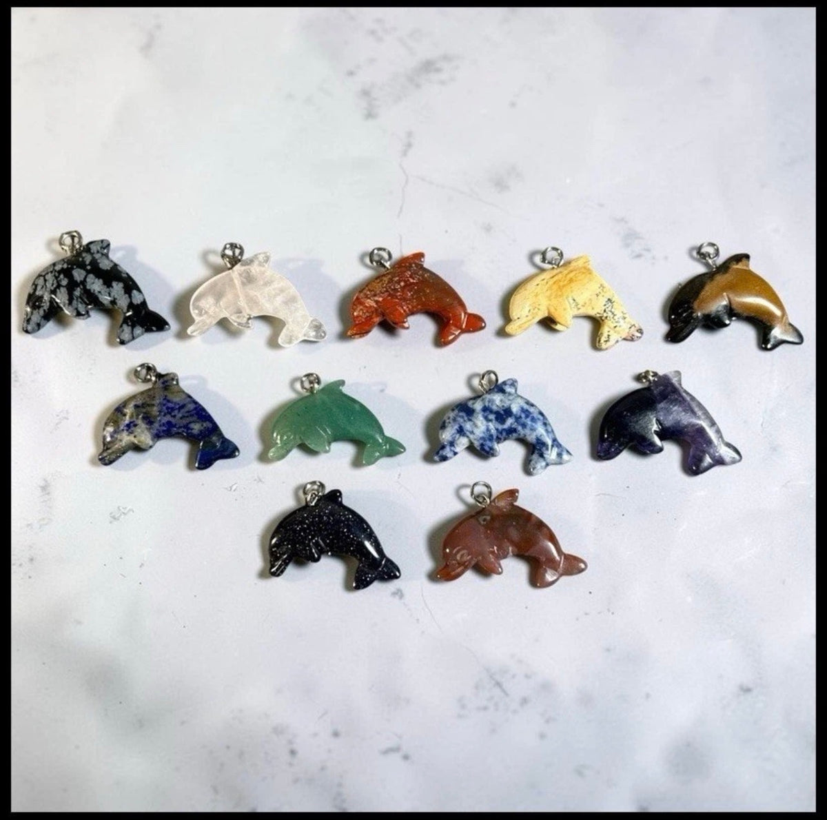 Lot of 11 Carved Polished Natural Gemstone, Crystal, and Art Glass Composite Dolphin Jewelry Pendants