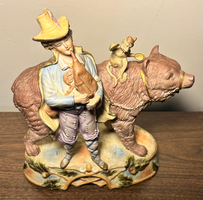 Circa 1930 German Scheibe-Alsbach Kister Bisque Porcelain Man with Bagpipes/Monkey with Cymbals Atop Grizzly Bear Figural Group