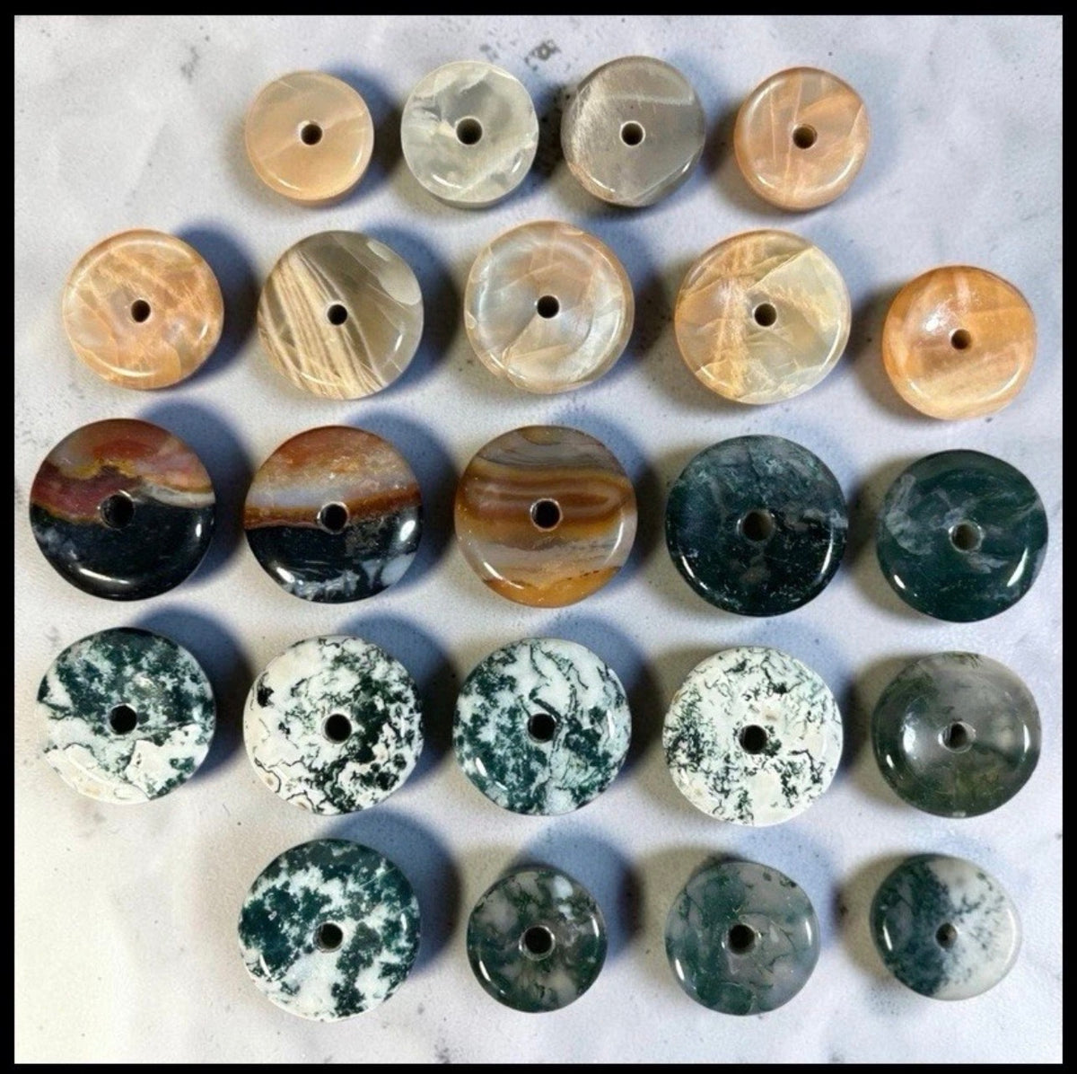 Lot of 22 Natural Carved Polished Carnelian, Banded Agate, Tree Agate, Moss Agate, and Quartz Donut Jewelry Pendants