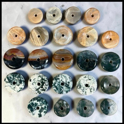 Lot of 22 Natural Carved Polished Carnelian, Banded Agate, Tree Agate, Moss Agate, and Quartz Donut Jewelry Pendants