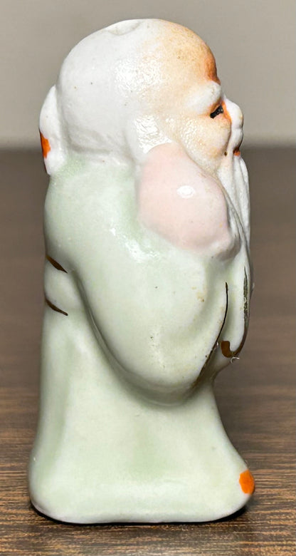 Circa Mid 19th Century Japanese Celadon Glazed Porcelain Fukurokuju Miniature Netsuke Figurine