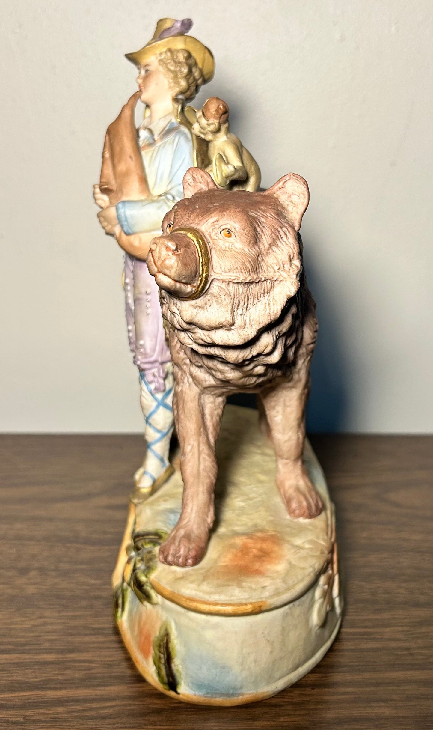 Circa 1930 German Scheibe-Alsbach Kister Bisque Porcelain Man with Bagpipes/Monkey with Cymbals Atop Grizzly Bear Figural Group