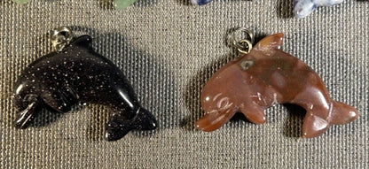 Lot of 11 Carved Polished Natural Gemstone, Crystal, and Art Glass Composite Dolphin Jewelry Pendants