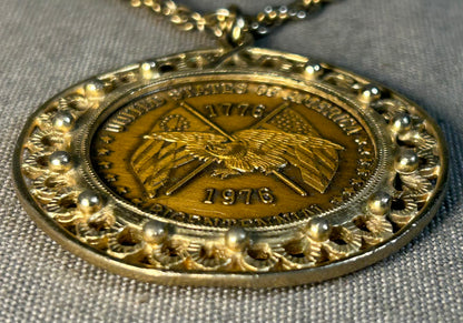 Vintage American 1976 Bicentennial Eagle and Flags/Liberty Bell Motifs Coin Gold-tone Metal Pendant Necklace