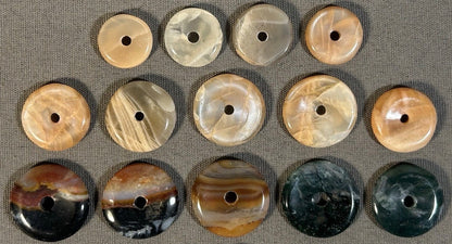 Lot of 22 Natural Carved Polished Carnelian, Banded Agate, Tree Agate, Moss Agate, and Quartz Donut Jewelry Pendants