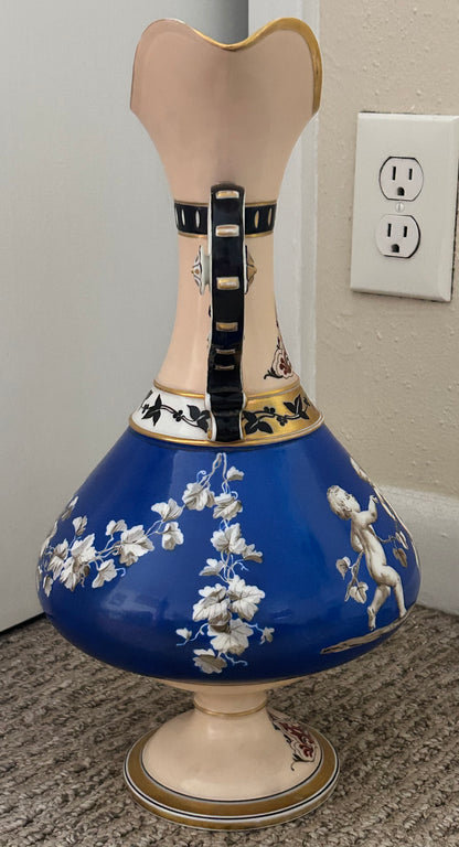 Mid 19th Century French Rococo Revival Porcelain Hand-Painted Gilded Bacchanal Putti Holding Vine Motif Double-Handled Footed Baluster Vase