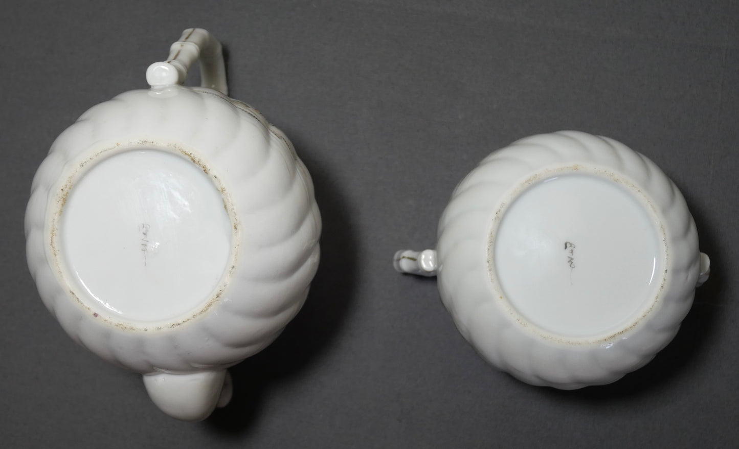 Circa 1920 Japanese Kutani Porcelain Hand Painted Village Motifs Bamboo Handled Teapot and Lidded Sugar Bowl Set (Taisho Period)