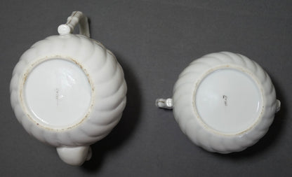 Circa 1920 Japanese Kutani Porcelain Hand Painted Village Motifs Bamboo Handled Teapot and Lidded Sugar Bowl Set (Taisho Period)