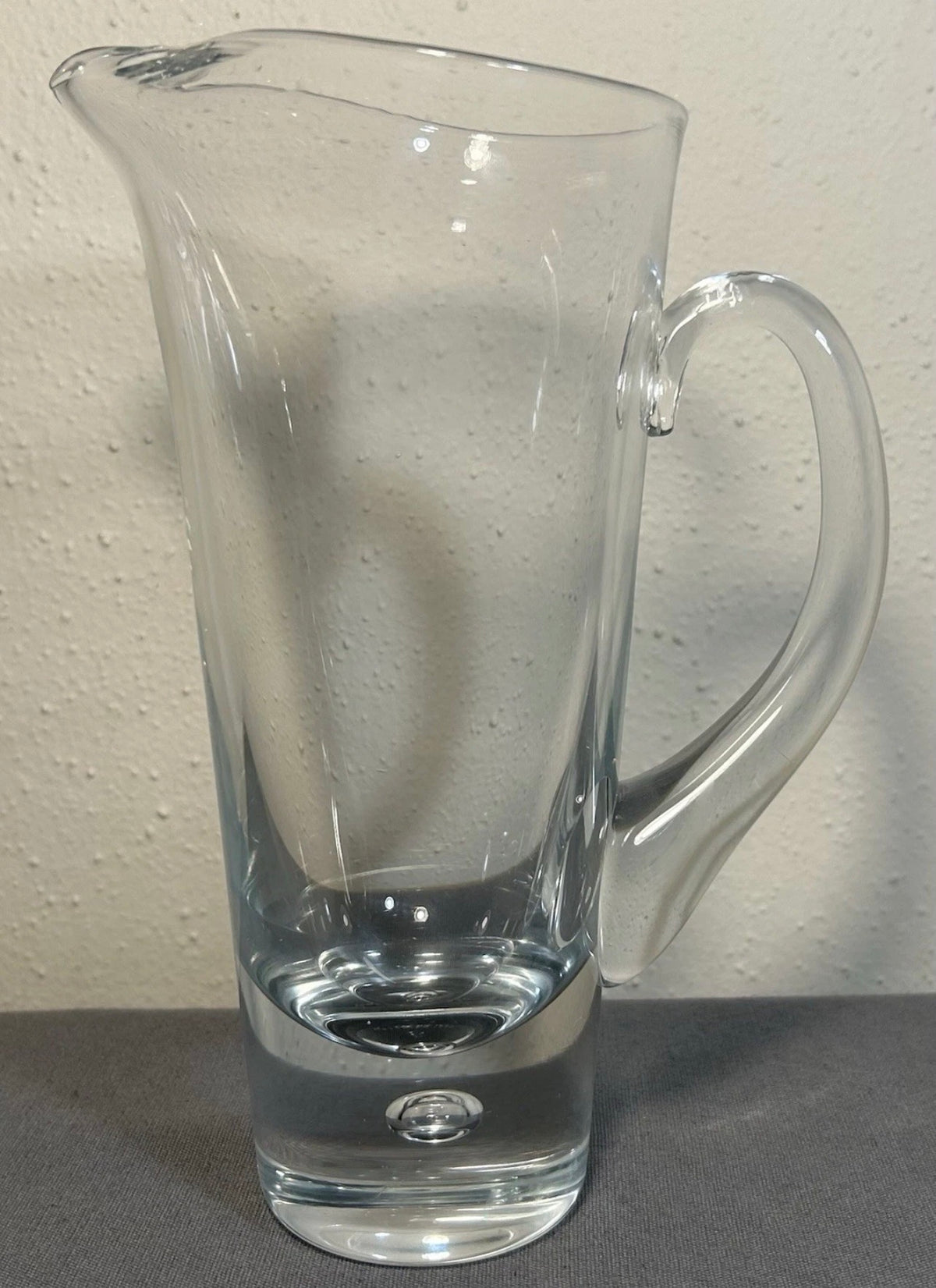 Vintage 1960’s Swedish Mid Century Modern Kosta Clear Art Glass Pippi Series Tall Pitcher with Controlled Bubble Weighted Base by Vicke Lindstrand (LH 1740)