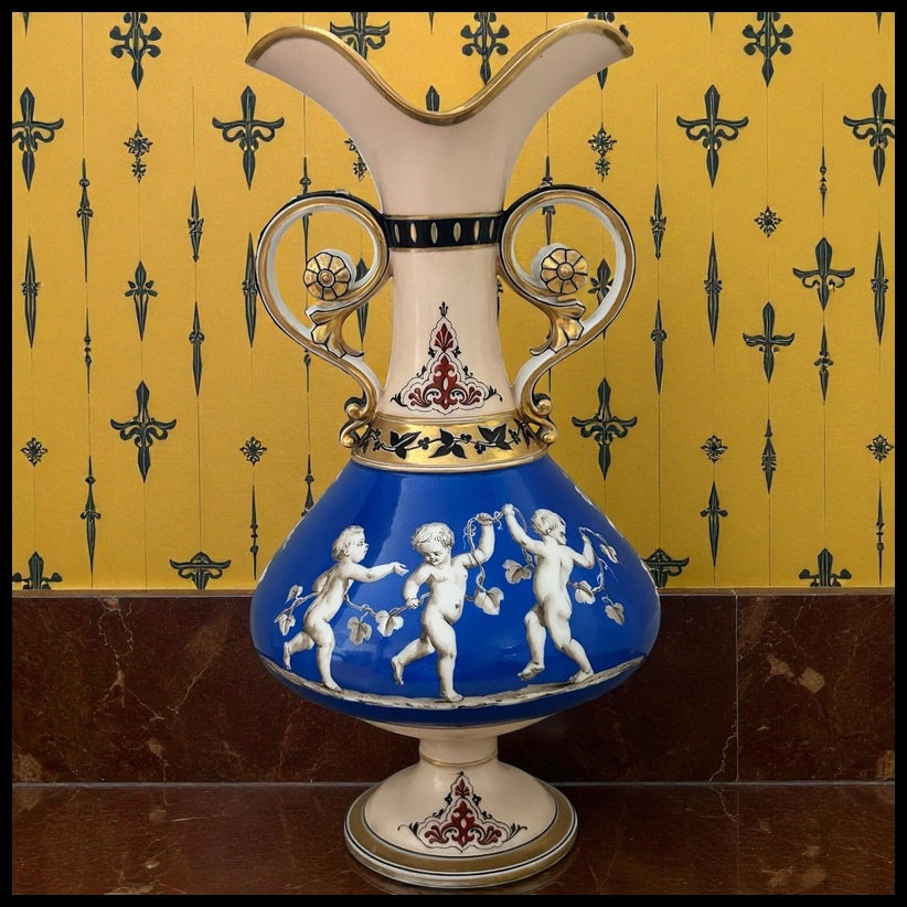 Mid 19th Century French Rococo Revival Porcelain Hand-Painted Gilded Bacchanal Putti Holding Vine Motif Double-Handled Footed Baluster Vase