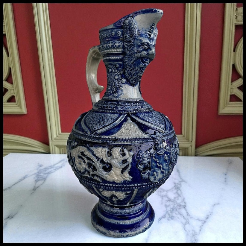 Mid 19th Century German Renaissance Revival Style Westerwald Salt Glazed Stoneware Coat of Arms Motif Satyr Spout Bulbous Footed Ewer