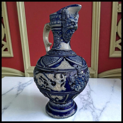 Mid 19th Century German Renaissance Revival Style Westerwald Salt Glazed Stoneware Coat of Arms Motif Satyr Spout Bulbous Footed Ewer