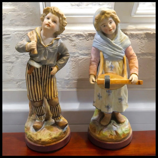 Pair of Late 19th Century French Victorian Mauger ets Fils Bisque Young Boy and Girl Figurines
