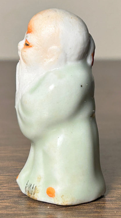 Circa Mid 19th Century Japanese Celadon Glazed Porcelain Fukurokuju Miniature Netsuke Figurine