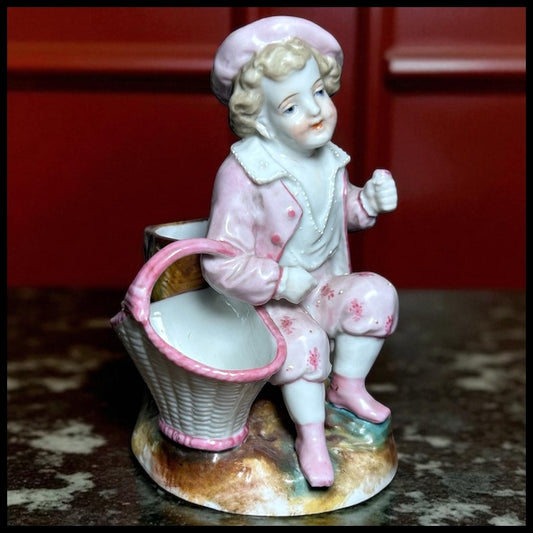 Circa 1870 German Victorian Conta & Boehme Porcelain Young Boy with Flower Basket Figural Matchstick Holder China Fairing