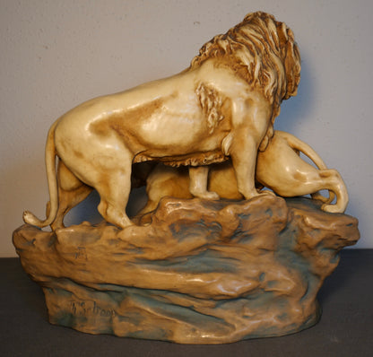 Circa 1900 Austrian Art Nouveau Theodore Schoop for Bernard Bloch Porcelain Lion and Lioness on Rock Figural Group Sculpture