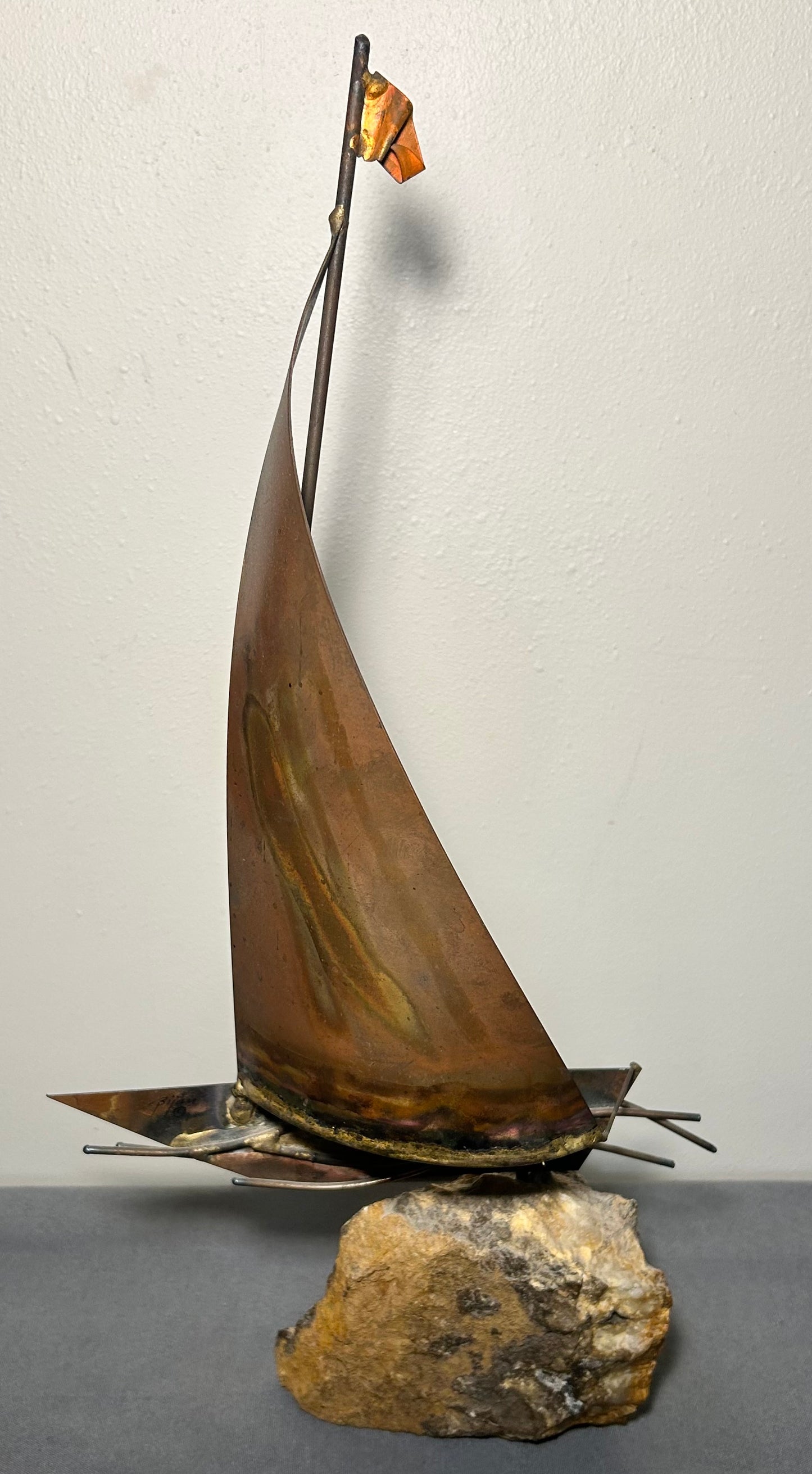 Vintage 1970’s American Brutalist Welded Copper/Brass Metal Sailboat on Stone Base Sculpture by Bijan Bahar