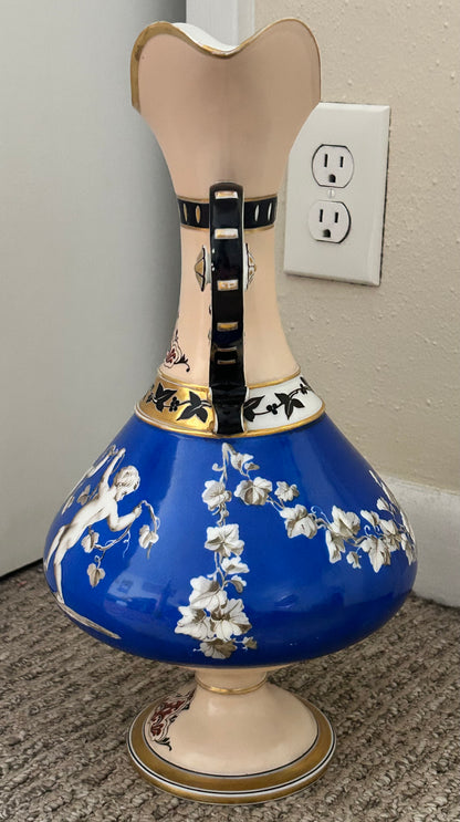 Mid 19th Century French Rococo Revival Porcelain Hand-Painted Gilded Bacchanal Putti Holding Vine Motif Double-Handled Footed Baluster Vase