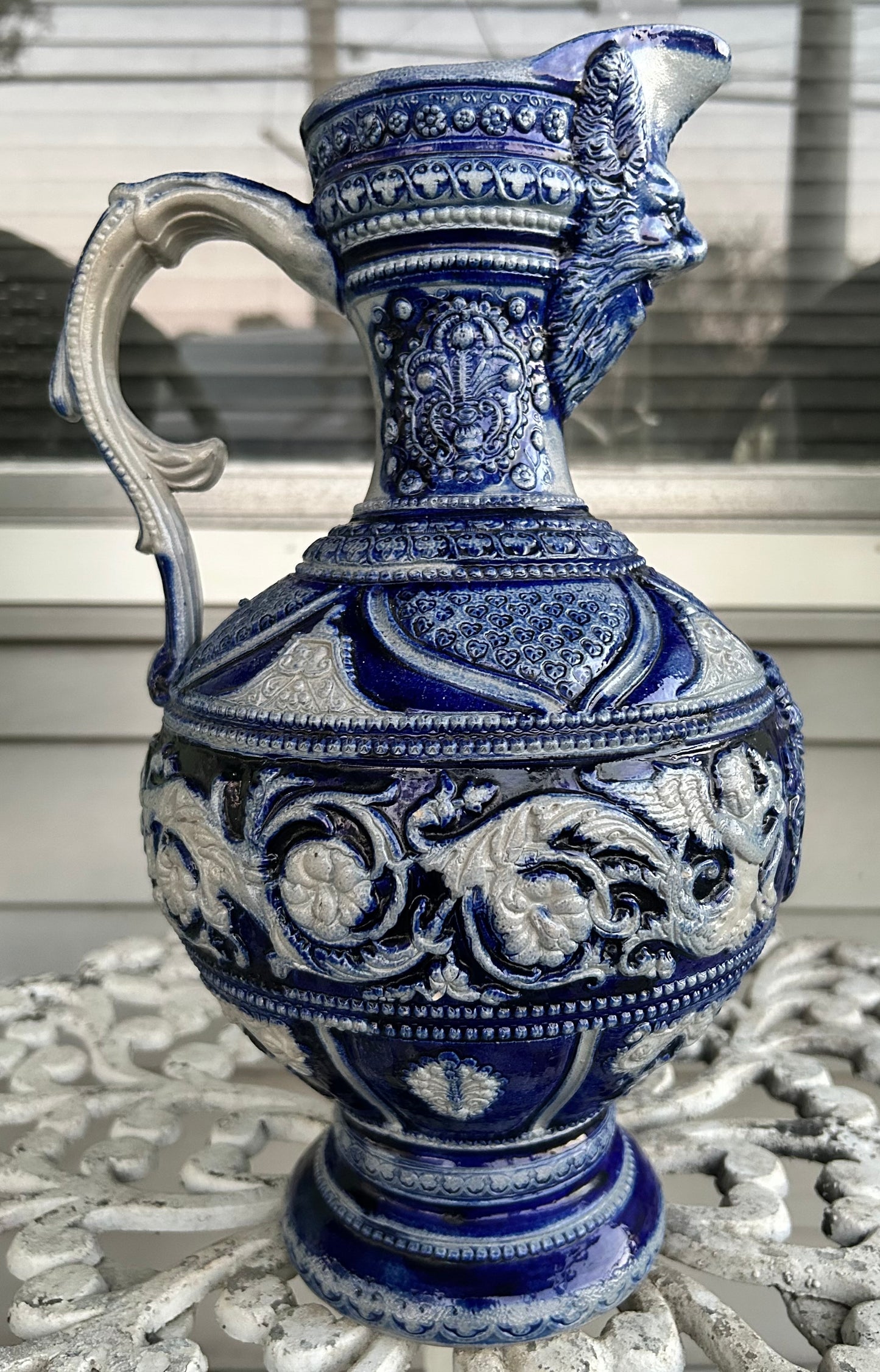 Mid 19th Century German Renaissance Revival Style Westerwald Salt Glazed Stoneware Coat of Arms Motif Satyr Spout Bulbous Footed Ewer