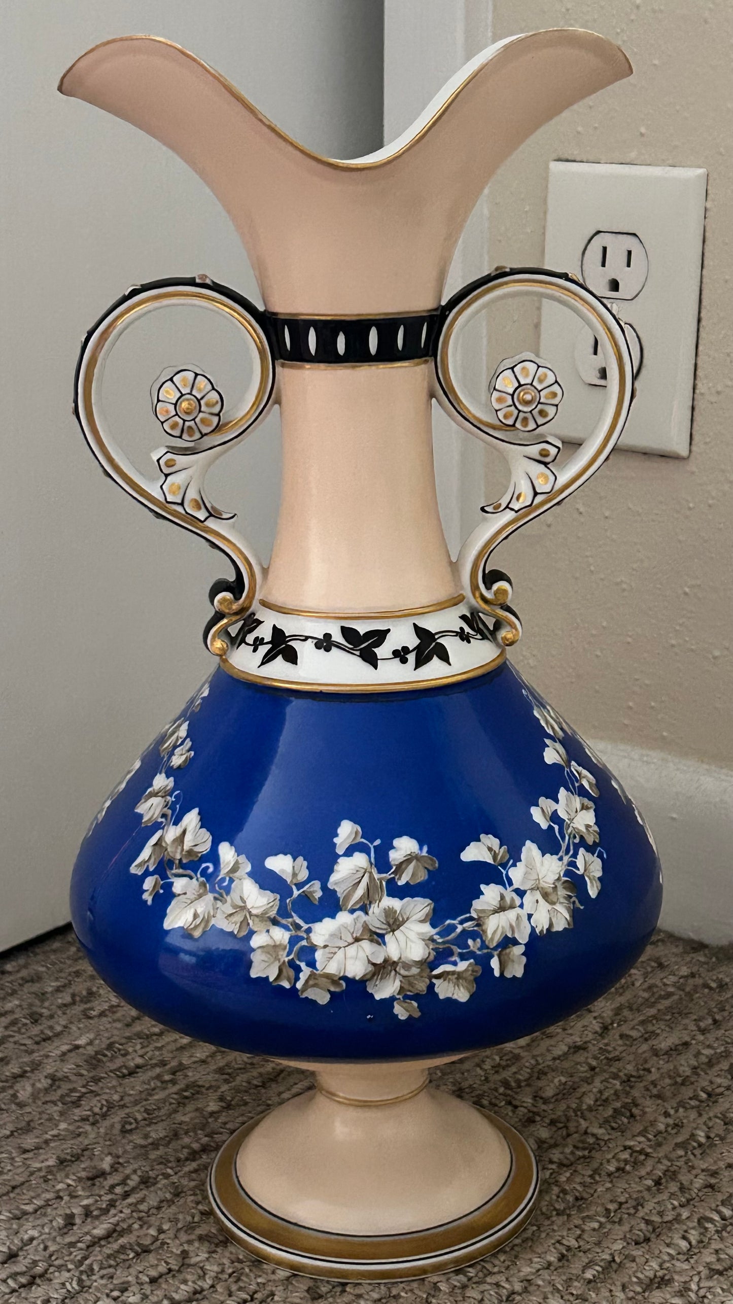 Mid 19th Century French Rococo Revival Porcelain Hand-Painted Gilded Bacchanal Putti Holding Vine Motif Double-Handled Footed Baluster Vase