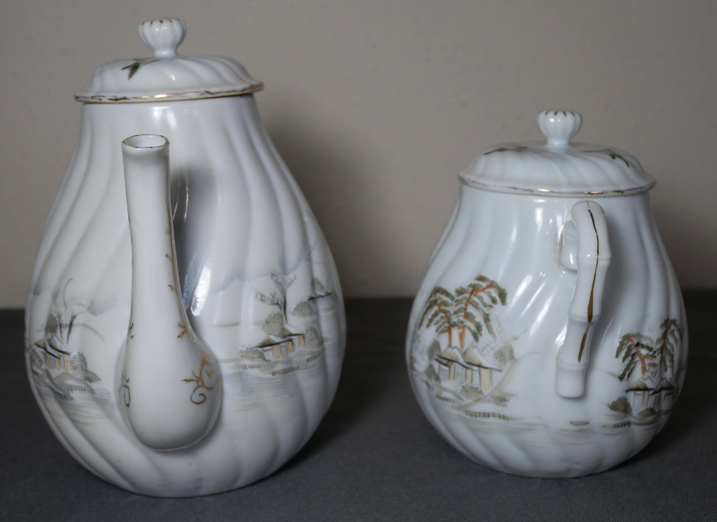 Circa 1920 Japanese Kutani Porcelain Hand Painted Village Motifs Bamboo Handled Teapot and Lidded Sugar Bowl Set (Taisho Period)