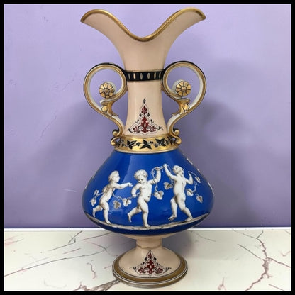 Mid 19th Century French Rococo Revival Porcelain Hand-Painted Gilded Bacchanal Putti Holding Vine Motif Double-Handled Footed Baluster Vase