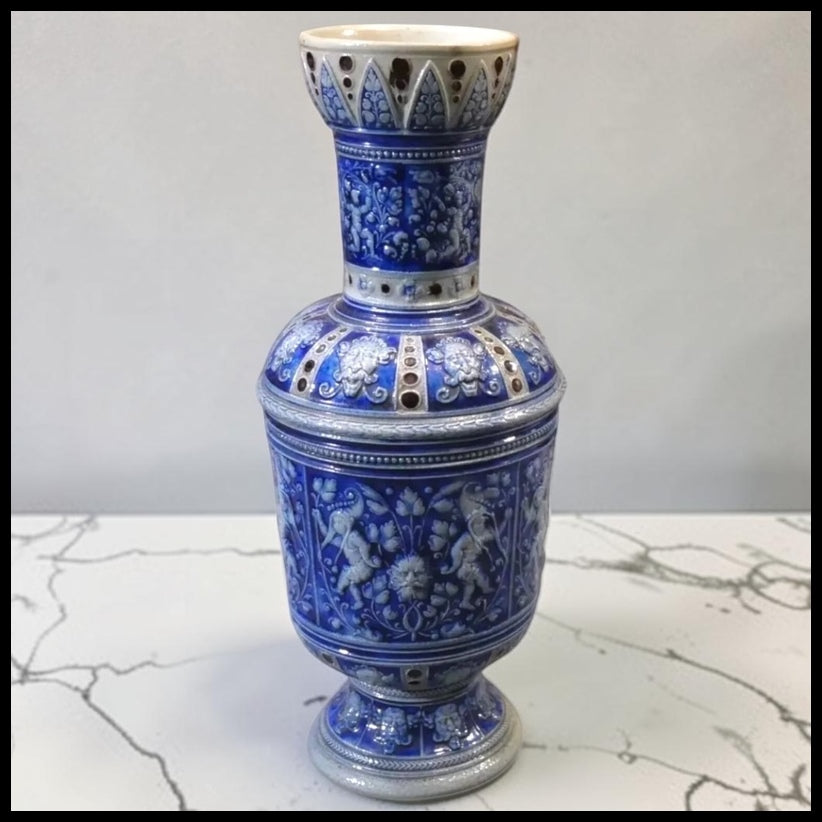 Late 19th Century German Renaissance Revival Westerwald Salt Glazed Stoneware Green Man/Cherubs/Mythical Figure Motifs Footed Rouleau Vase